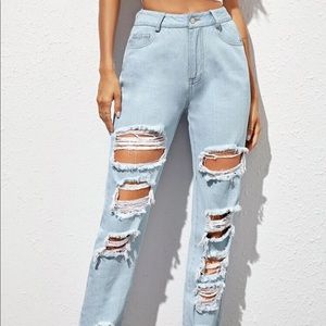 Ripped mom jeans. Light blue wash. High Rise